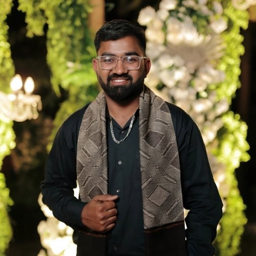 Nilesh Kumawat wearing traditional attire and smiling at a festive event