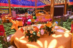 colorful outdoor wedding reception with ferris wheel centerpiece